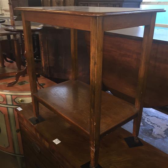 Mahogany two tier table on castors